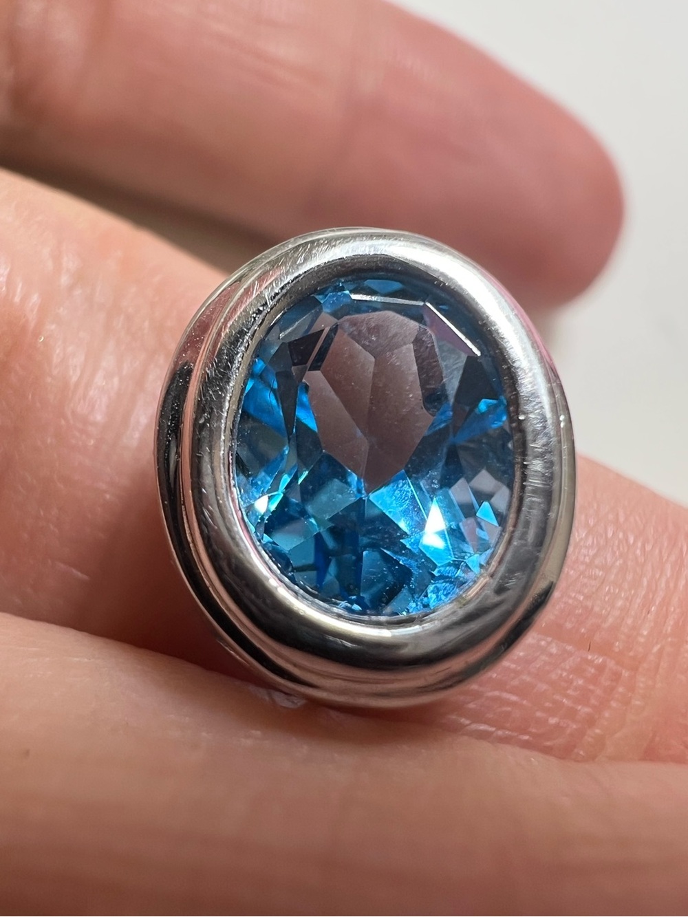 14K White Gold Blue Oval Faceted Topaz Pendant